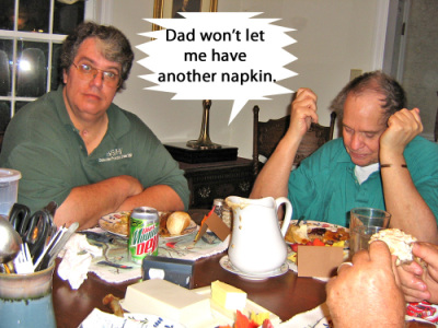 Dad gets a laugh from monitoring everyone's napkin usage.